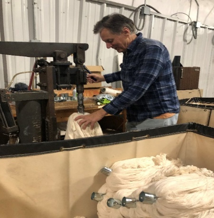 Mop heads being bound on the machine