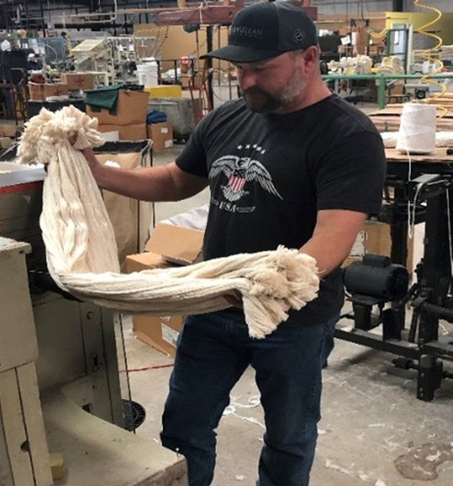 Wire-bound roofing mop head being finished by hand at Lafitte Roofing Products